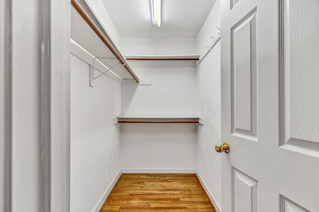 spacious closet with wood finished floors