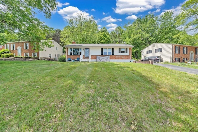 81 Ridgeview Cir, Roanoke, VA 24019 - ranch-style house featuring brick siding, a chimney, and a front lawn
