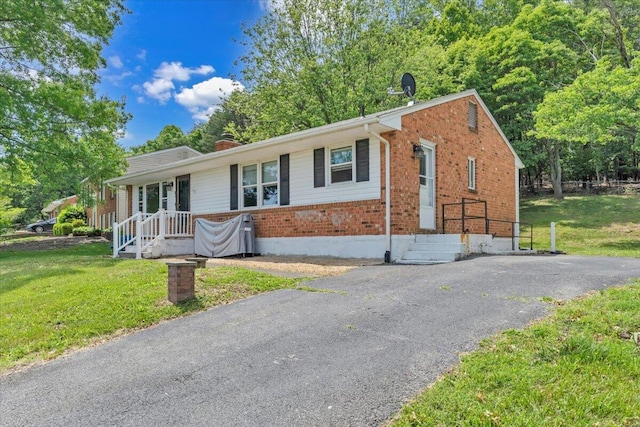 81 Ridgeview Cir, Roanoke, VA 24019 - ranch-style house featuring brick siding, a front yard, a chimney, and driveway