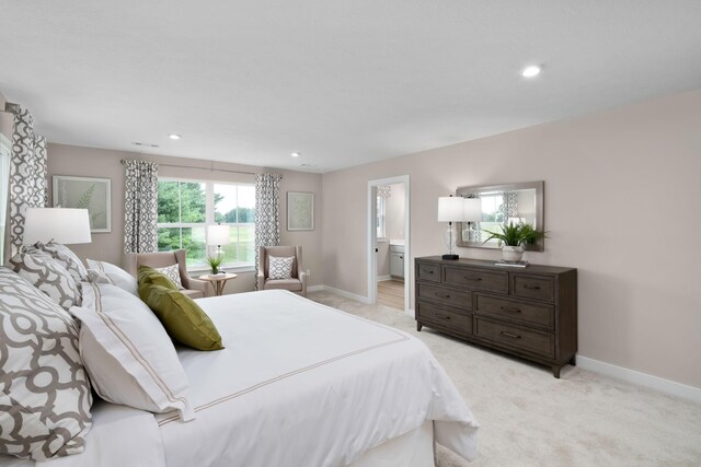 bedroom featuring baseboards, light carpet, and recessed lighting