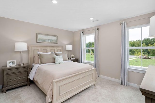 bedroom with light carpet, baseboards, and recessed lighting