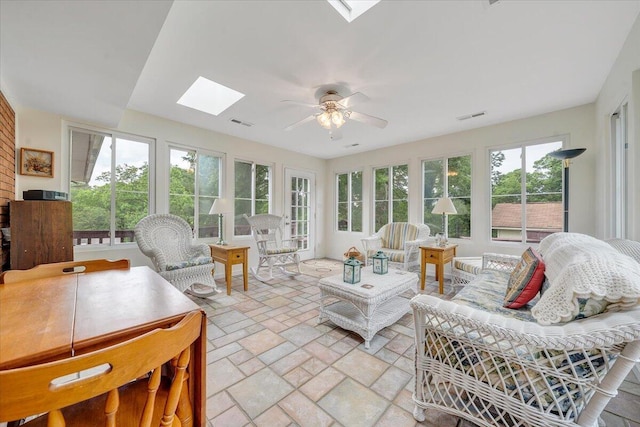 sunroom / solarium featuring a skylight