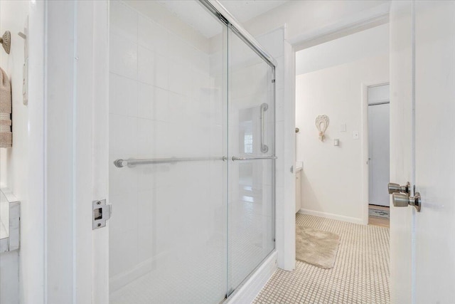 bathroom featuring a stall shower and tile patterned floors