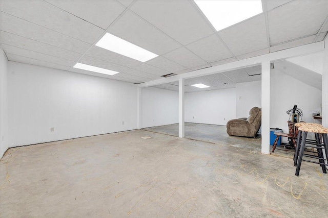 finished basement featuring a drop ceiling