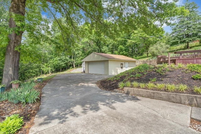 detached garage featuring driveway