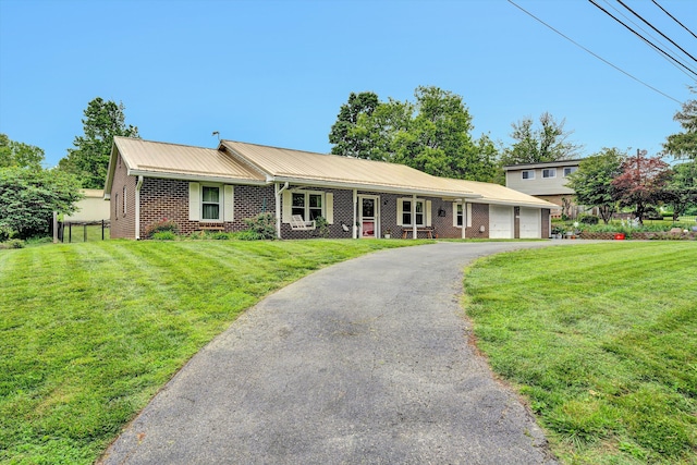 3643 Larson Ln, Roanoke, VA 24018 - ranch-style home with brick siding, driveway, a garage, and a front yard