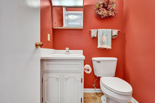 3643 Larson Ln, Roanoke, VA 24018 - half bath with vanity, tile patterned floors, baseboards, and toilet