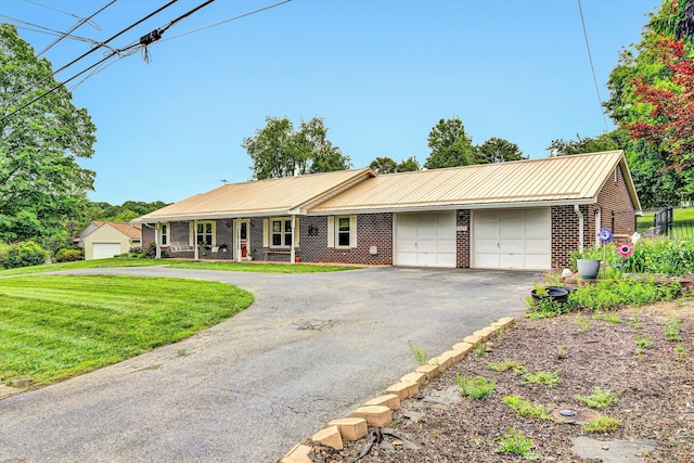 3643 Larson Ln, Roanoke, VA 24018 - single story home featuring a garage, driveway, brick siding, a front yard, and metal roof