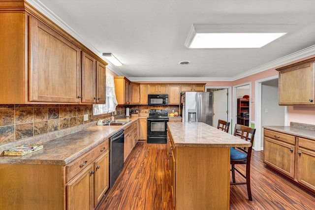 3643 Larson Ln, Roanoke, VA 24018 - kitchen featuring black appliances, a sink, dark wood-type flooring, a breakfast bar area, and a kitchen island