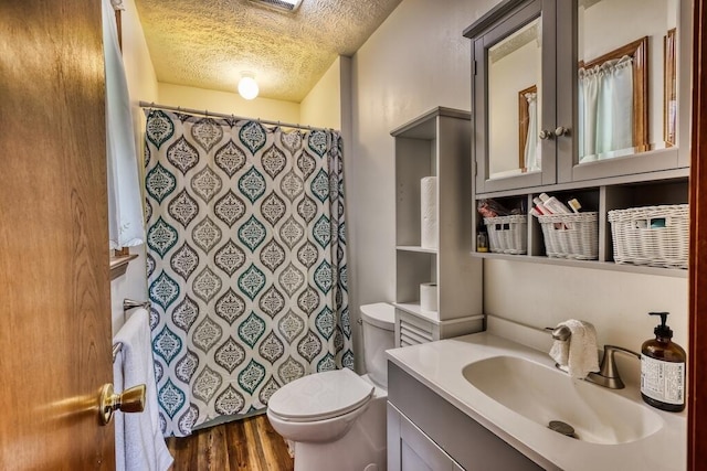 1530 Ridgeview Rd, Floyd, VA 24091 - bathroom with toilet, a textured ceiling, wood finished floors, vanity, and a shower with curtain
