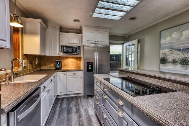 1530 Ridgeview Rd, Floyd, VA 24091 - kitchen featuring a sink, appliances with stainless steel finishes, white cabinets, dark wood finished floors, and decorative backsplash