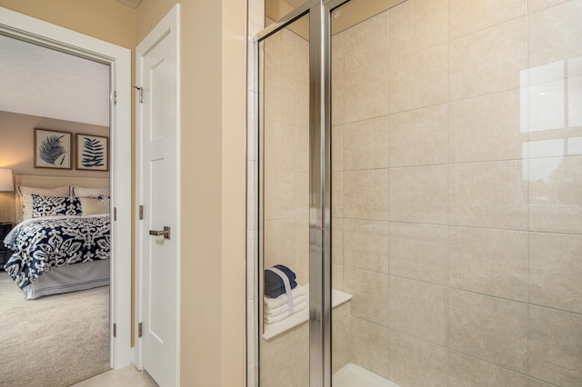 full bath featuring connected bathroom and a stall shower