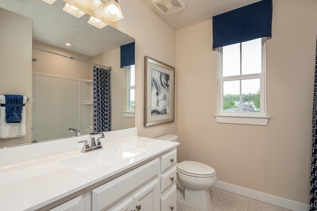 bathroom with baseboards, tile patterned flooring, toilet, vanity, and curtained shower