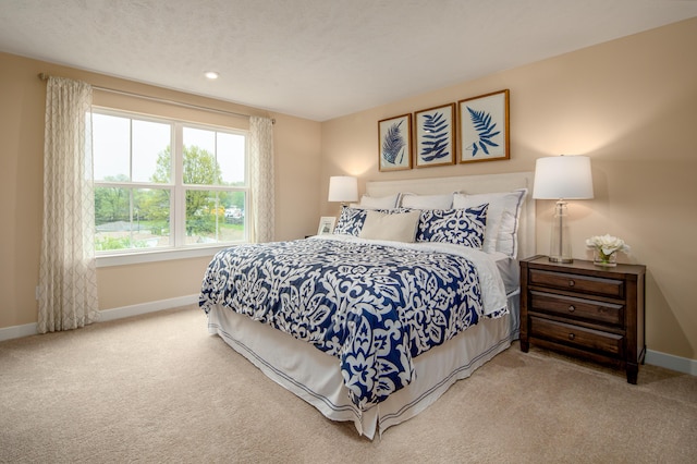 carpeted bedroom with baseboards and recessed lighting