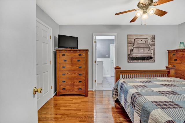 93 SW Ave, Buchanan, VA 24066 - bedroom with wood finished floors, ceiling fan, and ensuite bath