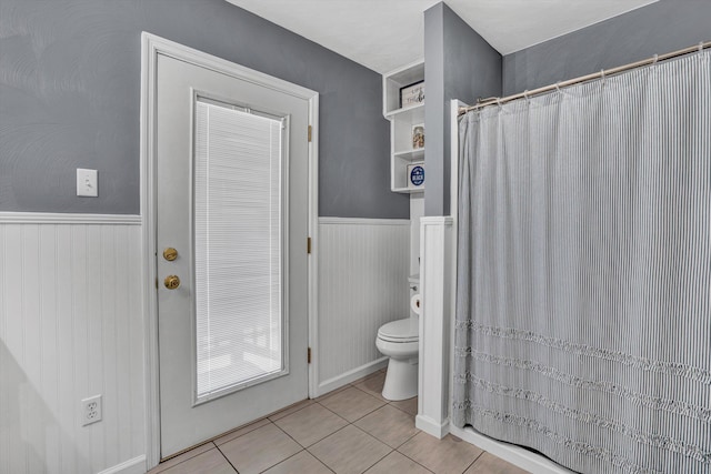 93 SW Ave, Buchanan, VA 24066 - full bathroom with tile patterned floors, toilet, a wainscoted wall, and curtained shower