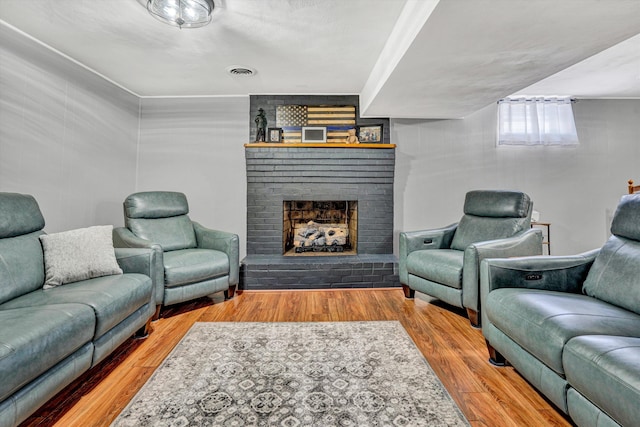 93 SW Ave, Buchanan, VA 24066 - living area featuring wood finished floors and a fireplace