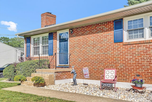 93 SW Ave, Buchanan, VA 24066 - property entrance featuring a chimney and brick siding