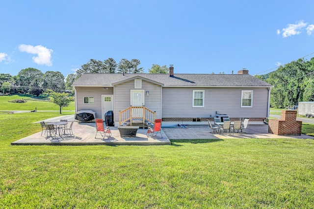 93 SW Ave, Buchanan, VA 24066 - back of house featuring a patio area, a lawn, and a shingled roof