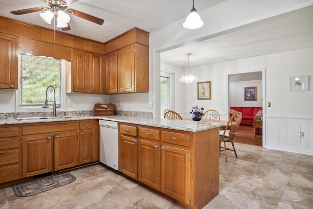 2844 Forage Rd, Shawsville, VA 24162 - kitchen with dishwasher, a sink, brown cabinets, a peninsula, and a textured ceiling