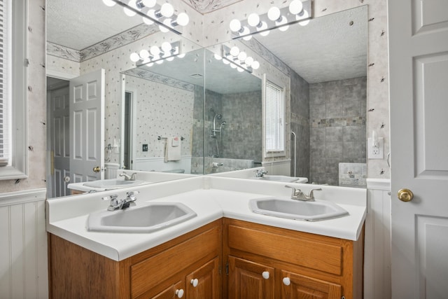 2844 Forage Rd, Shawsville, VA 24162 - full bath with a textured ceiling, tiled shower, double vanity, and wallpapered walls