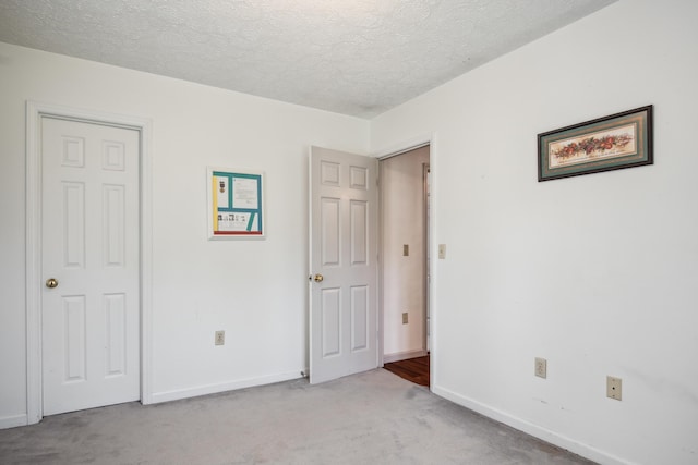 2844 Forage Rd, Shawsville, VA 24162 - unfurnished bedroom featuring carpet floors, baseboards, and a textured ceiling