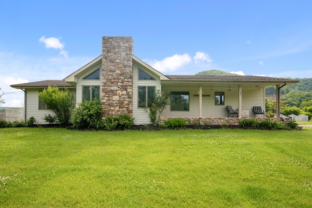 2844 Forage Rd, Shawsville, VA 24162 - back of house with a yard, a chimney, a porch, and roof with shingles