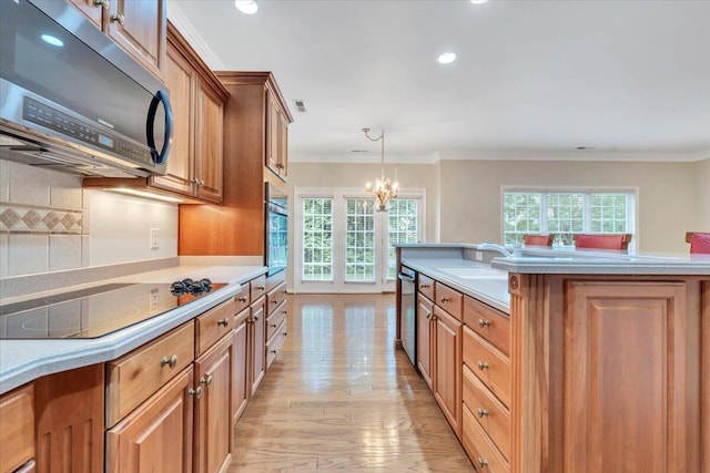 3326 Belshire Ct SW, Roanoke, VA 24014 - kitchen featuring stainless steel appliances, a sink, plenty of natural light, a chandelier, and recessed lighting