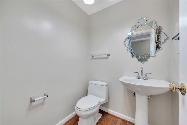 3326 Belshire Ct SW, Roanoke, VA 24014 - half bathroom with wood finished floors, toilet, and baseboards