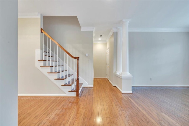 3326 Belshire Ct SW, Roanoke, VA 24014 - entryway featuring decorative columns, hardwood / wood-style floors, baseboards, crown molding, and stairs