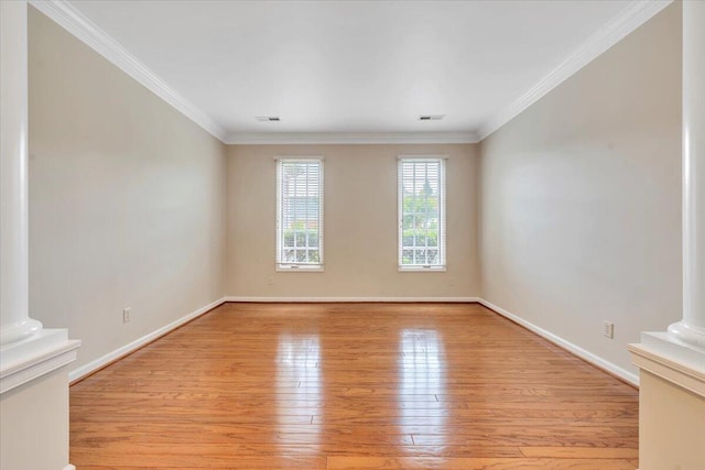 3326 Belshire Ct SW, Roanoke, VA 24014 - empty room featuring ornate columns, light wood-style flooring, baseboards, and ornamental molding