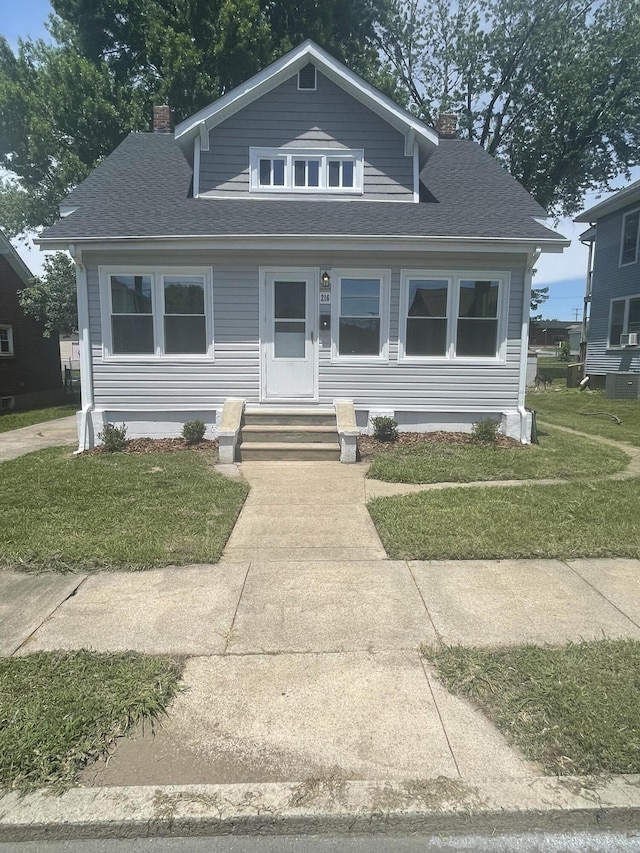 216 W Augusta Ave, Vinton, VA 24179 - bungalow-style house with a chimney, a shingled roof, and a front lawn