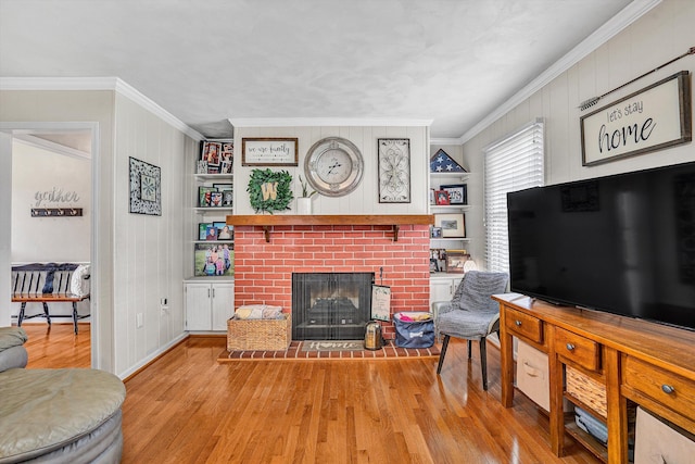 230 Pinehaven Rd, Fincastle, VA 24090 - living area featuring a brick fireplace, wood finished floors, crown molding, baseboards, and wood walls