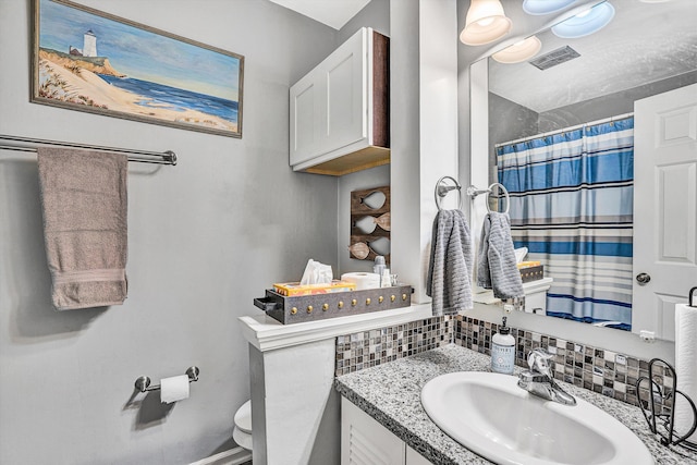 230 Pinehaven Rd, Fincastle, VA 24090 - full bathroom with toilet, decorative backsplash, vanity, and curtained shower