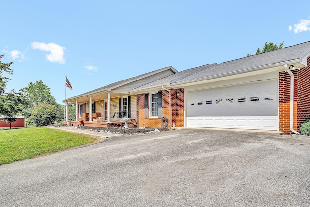 230 Pinehaven Rd, Fincastle, VA 24090 - ranch-style home featuring covered porch, brick siding, asphalt driveway, an attached garage, and a front yard