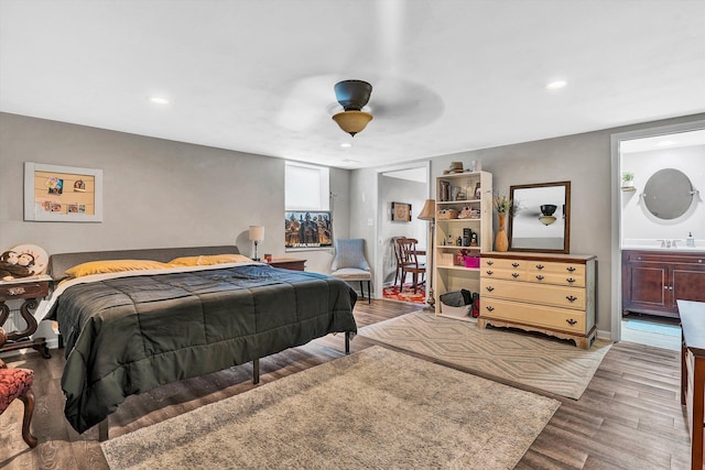 230 Pinehaven Rd, Fincastle, VA 24090 - bedroom featuring wood finished floors, recessed lighting, a ceiling fan, a sink, and ensuite bath