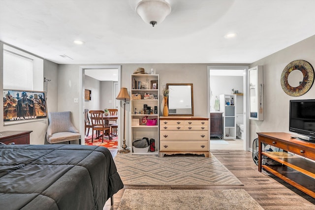 230 Pinehaven Rd, Fincastle, VA 24090 - bedroom with wood finished floors, connected bathroom, recessed lighting, and baseboards