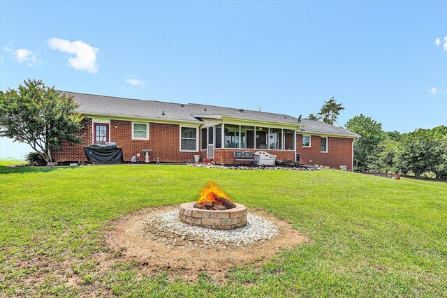 230 Pinehaven Rd, Fincastle, VA 24090 - rear view of property with an outdoor fire pit, a sunroom, brick siding, and a yard