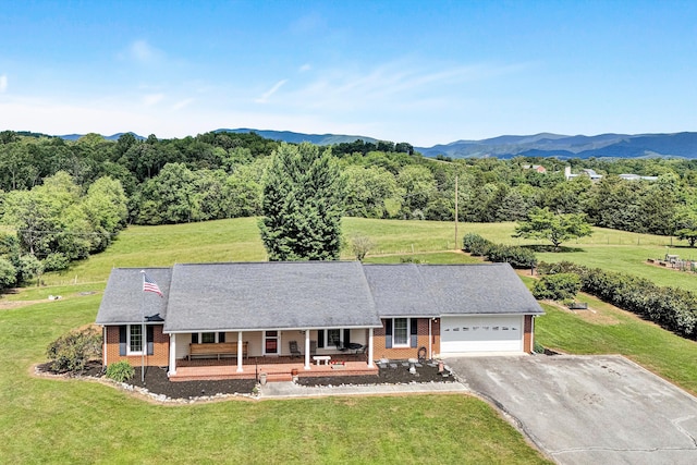 230 Pinehaven Rd, Fincastle, VA 24090 - view of front of home with a porch, brick siding, driveway, a garage, and a front yard