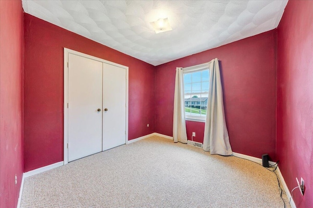 7073 Northway Dr, Roanoke, VA 24019 - unfurnished bedroom featuring carpet flooring, baseboards, and a closet