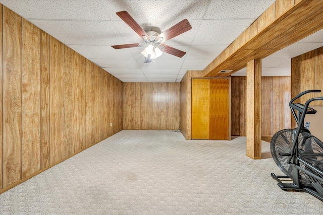 7073 Northway Dr, Roanoke, VA 24019 - finished basement featuring wood walls, a drop ceiling, carpet floors, and a ceiling fan