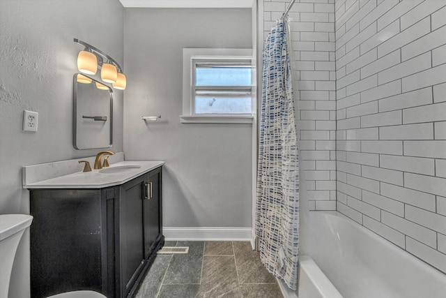 bathroom with toilet, baseboards, vanity, shower / bath combo with shower curtain, and tile patterned flooring