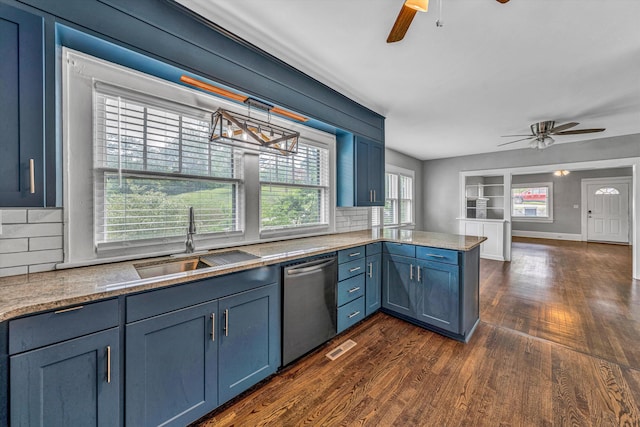 kitchen with stainless steel dishwasher, ceiling fan, a sink, and dark wood finished floors