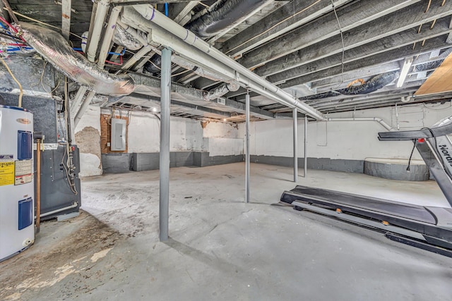 unfinished below grade area featuring water heater and electric panel