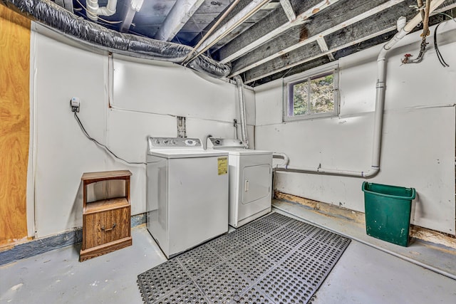 clothes washing area with washing machine and clothes dryer