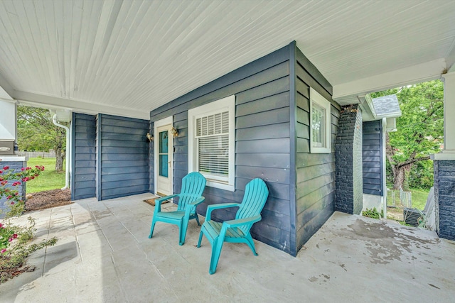 view of patio featuring a porch