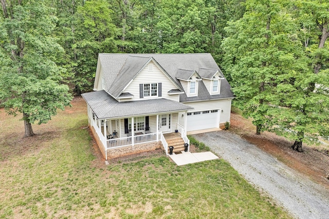 1309 W Pine Ridge Rd, Huddleston, VA 24104 - view of front facade featuring covered porch, driveway, a forest view, a front lawn, and roof with shingles