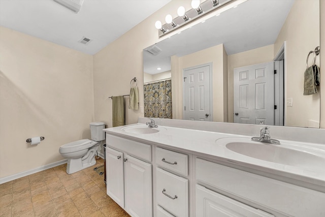 1309 W Pine Ridge Rd, Huddleston, VA 24104 - bathroom with baseboards, toilet, and double vanity