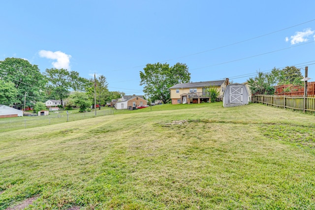 view of yard featuring a storage shed and an outbuilding