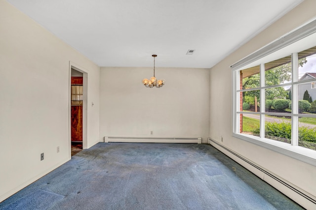 carpeted empty room featuring baseboard heating, a chandelier, and baseboards